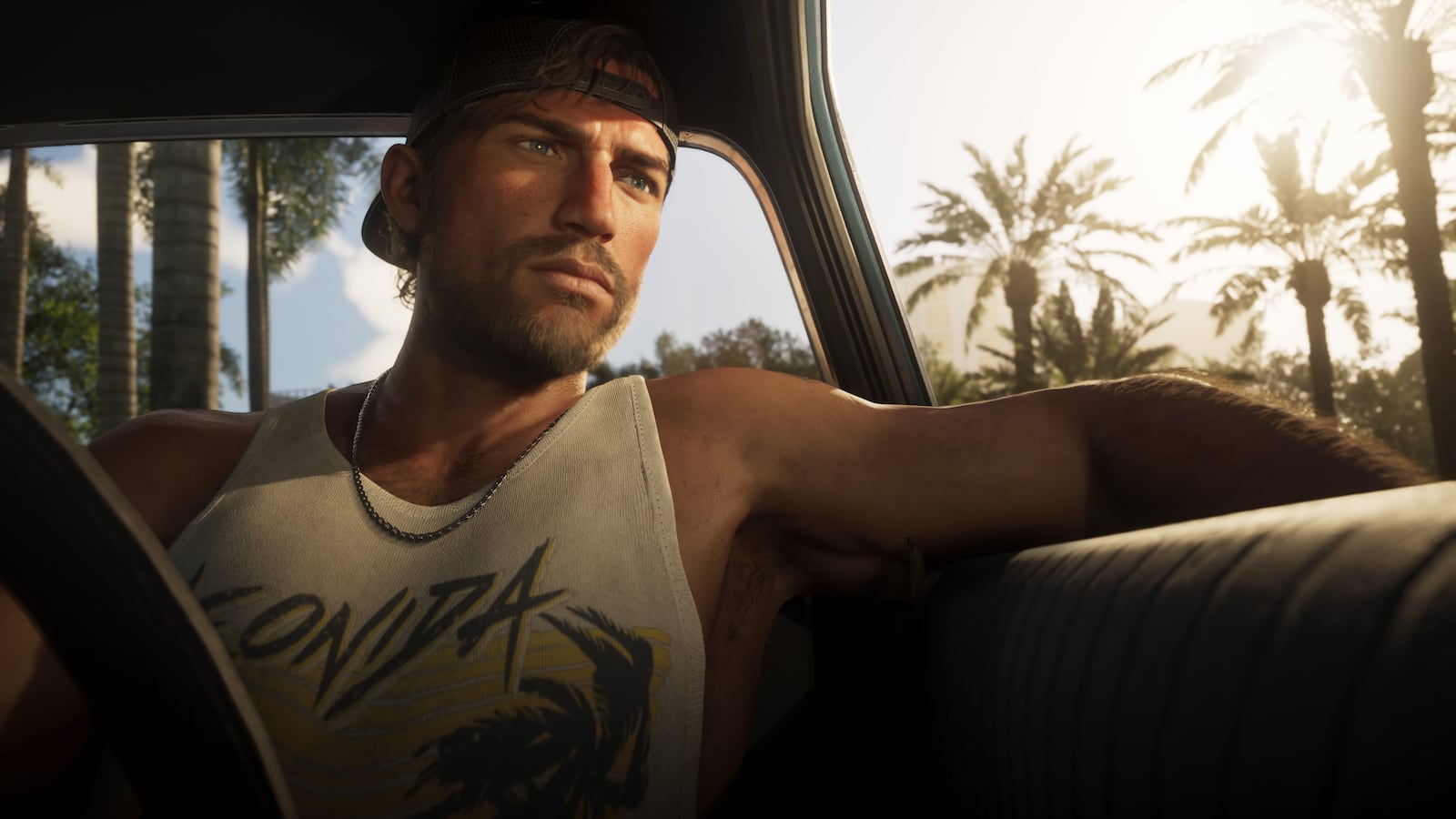 Jason 驾车穿过 Leonida 夕阳街道的 GTA VI 官方截图